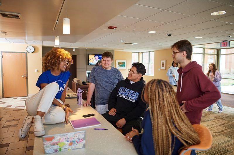 GVSU students in a housing lounge.